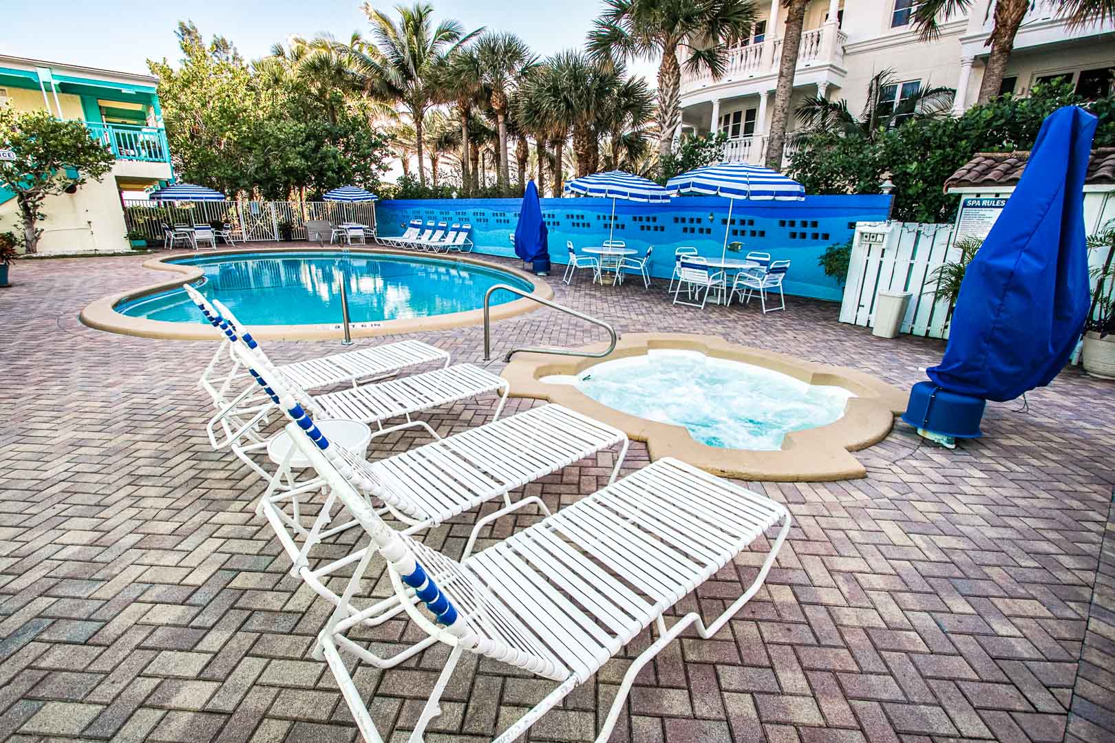 A relaxing outdoor swimming pool at VRI's Sand Dune Shores in Florida.